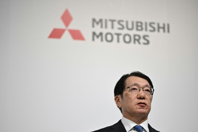 Takao Kato, le patron de Mitsubishi Motors, lors d'une conférence de presse à Tokyo, le 23 décembre 2024, avec ses homologues de Nissan et Honda ( AFP / Philip FONG )